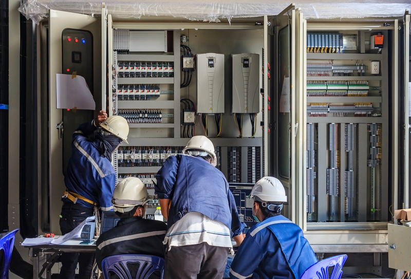 engineer-working-checking-maintenance-equipment-wiring-plc-cabinet.jpg