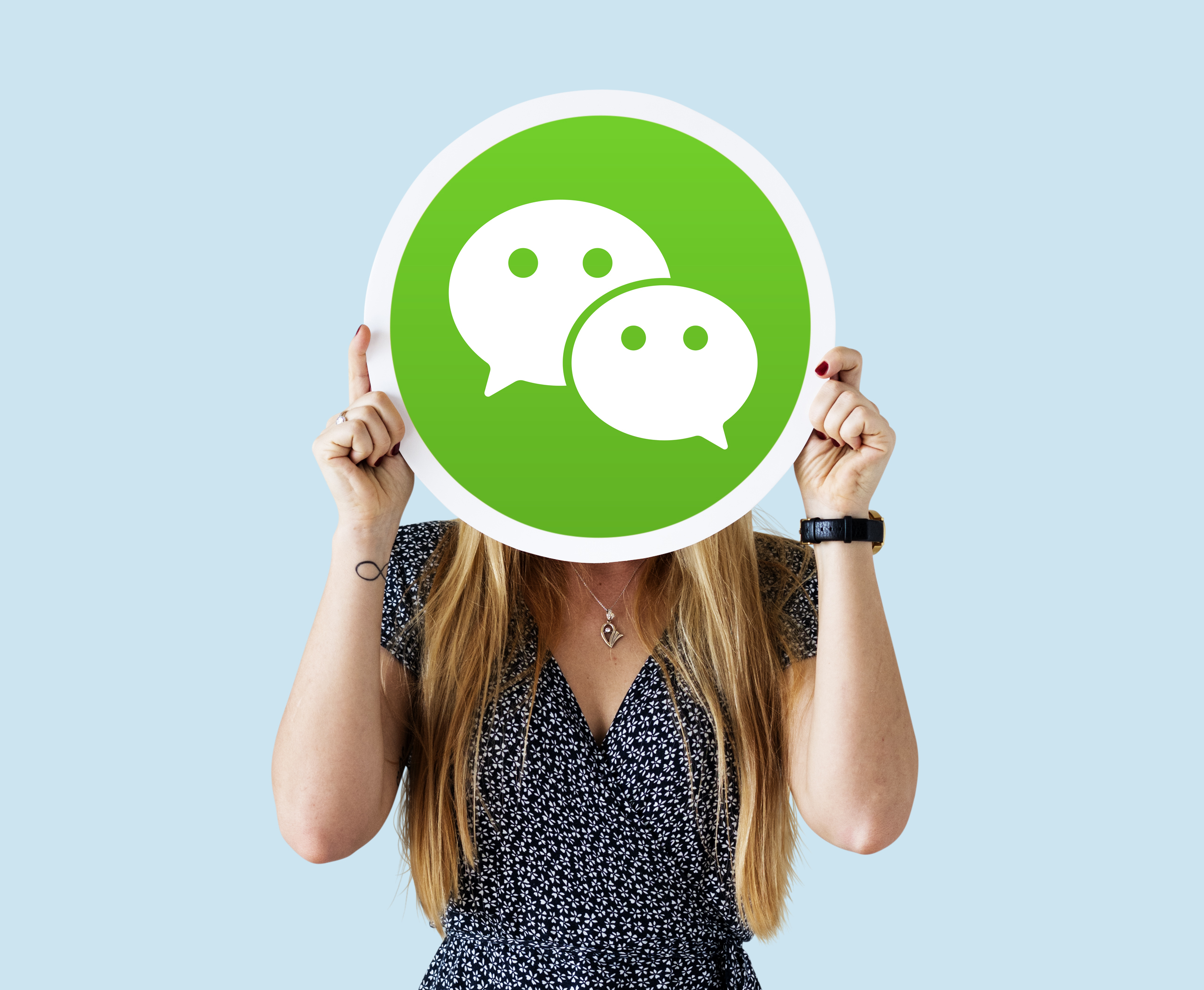 woman-showing-wechat-icon.jpg