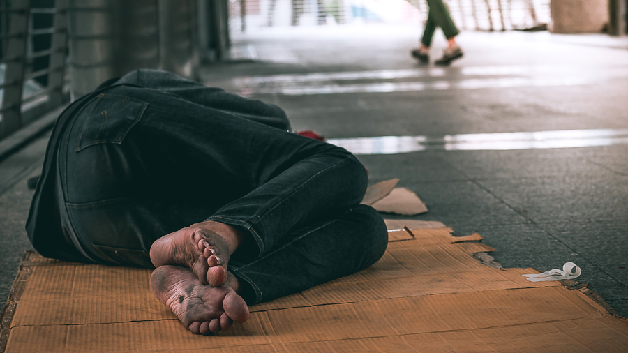 close-up-feet-homeless-man-sleeping-dirty-floor-urban-street-city.jpg